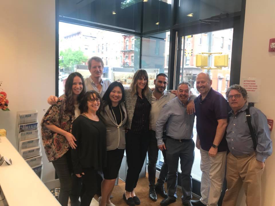 Nandar Matari with the Douglas Elliman brokers in their Park Slope office